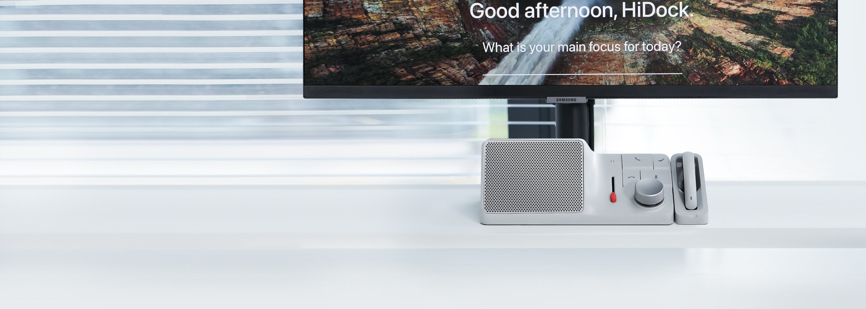 HiDock H1 with its earphone on a bright desk